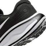 Championes de running Nike modelo Journey Run, color negro con detalles en blanco. Presentan una parte superior de malla transpirable y una entresuela acolchada de gran volumen para mayor amortiguación.