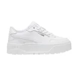 Championes Puma modelo Karmen II Idol, diseño de plataforma con capellada de cuero sintético y detalles de perforaciones. Presenta el logo de la marca en el lateral y lengüeta.