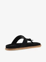 Sandalia tipo ojota de cuero negro con diseño de tira central con nudo y base de corcho.