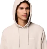 Buzo con capucha y bolsillo canguro frontal, confeccionado en tejido suave con puños y dobladillo acanalados. Presenta un pequeño parche con el logo de la marca en el pecho.