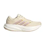 Championes de running adidas Response 2, color beige con las icónicas tres tiras en tono rosado y dorado, suela gruesa Cloudfoam y detalles en el talón.
