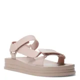 Sandalias de plataforma plana estilo Teva de color beige, con tiras anchas de goma ajustables mediante velcro en el empeine y el talón.