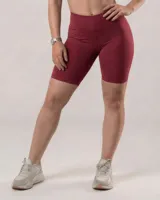 Calza biker de tiro alto, color rojo jaspeado, confeccionada en algodón y lycra opaca. Presenta una faja doble tela sin elástico superior para mayor sujeción.