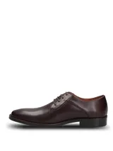 Zapato de vestir formal tipo derby, confeccionado en cuero vacuno color vino con acabado brillante. Presenta cierre mediante cordones al tono, costuras reforzadas y suela de goma resistente.