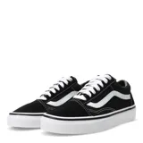 Championes Vans modelo Old Skool, de diseño clásico urbano. Presentan una combinación de lona y gamuza en color negro, con la icónica banda lateral blanca en contraste. Cuentan con suela de goma tipo waffle, punteras reforzadas y cuello acolchado para mayor comodidad.