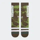 Medias Stance OG negras con rayas blancas horizontales en el tobillo y logo de la marca en la caña.