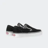 Championes Vans Classic Slip-On negros con suela blanca de goma.