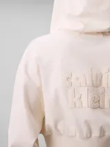 Buzo cropped con capucha y cierre frontal de Calvin Klein, confeccionado en punto milano. Presenta mangas largas con puños acanalados, dobladillo inferior también acanalado y cordones ajustables en la capucha.