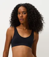 Soutien top femenino marca Lov, modelo bralette confeccionado en poliamida seamless con textura acanalada, escote redondo y base ancha. Cuenta con copas desmontables y tecnología sin costuras.