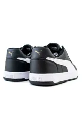 Championes Puma Caven 2.0 de estilo urbano, color negro con detalles en blanco y logotipos dorados.