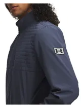 Campera Under Armour modelo Drive Pro FZ, color azul, con cierre frontal completo, cuello alto y aislamiento acolchado en el pecho y la parte superior de la espalda.
