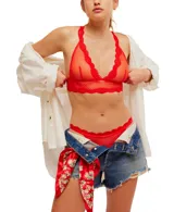 Bralette negro de malla transparente con ribete de encaje y espalda cruzada.