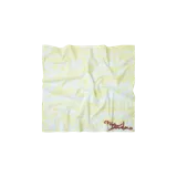 Pañuelo tipo bandana de color amarillo con estampado tipográfico en tonos claros y firma en color marrón.