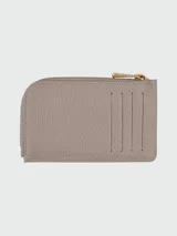 Tarjetero Longchamp de la línea Le Foulonné, confeccionado en cuero granulado negro. Presenta un diseño compacto con cierre superior de cremallera metálica dorada y logo de la marca grabado en el frente.
