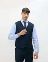 Chaleco formal sastrero Harrington Select de color azul marino, con cuello en V, cierre frontal de botones y bolsillos ribeteados.