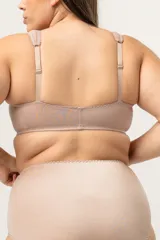 Soutien reductor clásico reforzado prendido adelante, sin aro. Breteles anchos acolchados regulables. Ganchos reforzados. Confeccionado con tela que contiene fibra LYCRA
