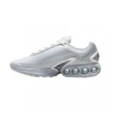 Championes Nike Air Max Dn de diseño moderno en color blanco. Presentan una parte superior de malla técnica transpirable y una unidad de amortiguación Air Max visible en el talón con cuatro cámaras de aire circulares. Incluyen detalles en gris claro y un pequeño logo de la marca en el lateral.