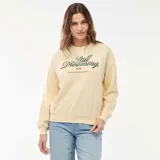 Buzo de cuello redondo y manga larga, confeccionado en felpa ligera color crema. Presenta un estampado frontal con la frase 'Still Dreaming' en color verde oscuro.