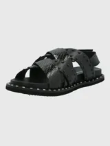 Sandalias negras de cuero con tiras cruzadas y detalles de tachas.