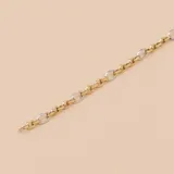 Pulsera de eslabones ovalados alternados en oro blanco y oro amarillo de 9k.