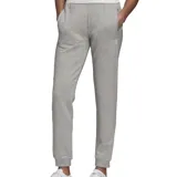 Pantalón de jogging gris con cintura elástica ajustable con cordón, bolsillos laterales y logo de Adidas bordado en la pierna izquierda.