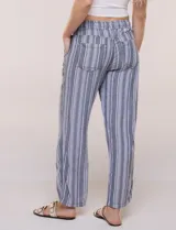 Pantalón de lino blanco, marca Dash, con pretina ancha elastizada, lazo de ajuste y bolsillos inclinados en el frente.