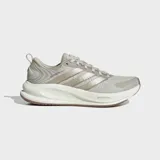 Championes de running Adidas Supernova Ease 2, color beige con las icónicas tres tiras en tono metálico y suela blanca con tecnología Dreamstrike.