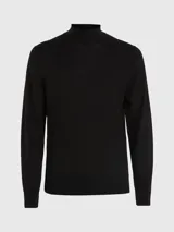 Sweater negro de cuello perkins confeccionado en lana merino extrafina. Tiene cuello, puños y bajo de canalé.
