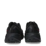 Championes de trail running New Balance Fresh Foam X Hierro v9, color negro con suela Vibram y detalles en naranja.