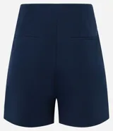 Short de sastrería negro, tiro alto, con cierre frontal de botones visibles.