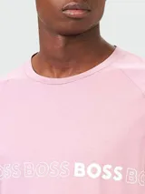 Remera rosa de algodón con corte slim fit y logo "BOSS" estampado en el pecho.