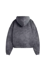 Hoodie de corte oversize con efecto de lavado desgastado en color gris oscuro. Presenta capucha amplia, bolsillo tipo canguro frontal y estampado tipográfico en blanco en el pecho.