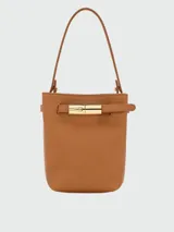 Cartera bucket extra pequeña Longchamp modelo Le Smart Flow, color negro con textura granulada, asa de hombro y detalle de hebilla metálica dorada frontal.