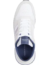 Zapatillas de running Tommy Hilfiger blancas con detalles en azul y rojo.