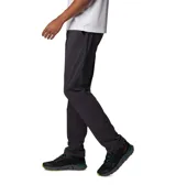 Pantalon de senderismo Columbia Tech Trail II, color gris oscuro, con tecnología de repelencia al agua Omni-Shield y protección solar UPF 50. Presenta cintura con elástico parcial, bolsillos laterales y bolsillo de seguridad con cierre.