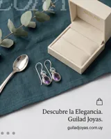 Caravanas colgantes de plata 925 con diseño de doble piedra facetada: una piedra superior circular de agua marina y una piedra inferior ovalada de amatista, ambas engarzadas en plata.