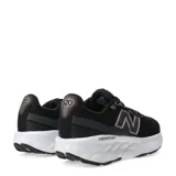Championes de running New Balance modelo Fresh Foam 520, color negro con detalles en tono rosado metálico. Presentan capellada de malla transpirable, logo lateral característico y entresuela con tecnología Fresh Foam para mayor amortiguación.