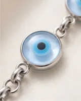 Pulsera de eslabones de acero con dijes circulares tipo ojo turco en tonos celestes y blancos.