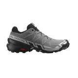 Championes de trail running Salomon Speedcross 6, color gris y negro, con tecnología GORE-TEX impermeables, sistema de cordones quickLACE y suela contagrip con tacos profundos para mayor agarre.