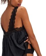 Túnica negra de poliéster y nylon con escote en V y detalles de encaje en los bordes y tirantes.