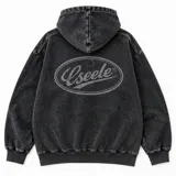 Campera con capucha y cierre frontal Eseele, modelo Eseele Club Stone, con acabado stonewash de efecto desgastado en color gris carbón, bolsillos delanteros y logo ovalado retro en la espalda.