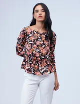 Blusa Zac & Rachel de gasa estampada en blanco y azul, con cintura elastizada y frunces. Mangas 3/4 fruncidas.