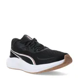 Championes de running Puma Skyrocket Lite 2 para mujer, con capellada de malla textil transpirable en color negro. Presentan entresuela PUMALITE blanca para amortiguación reactiva, plantilla SOFTFOAM+ para mayor confort y suela de goma en tono marrón. Incluyen detalles en color cobre en el logo y laterales.