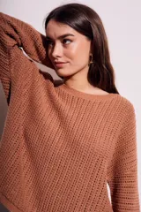 Sweater celeste de tejido de punto calado con lurex, de corte holgado y mangas largas.