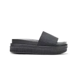 Sandalias tipo ojota color negro, con faja superior de textura geométrica, plataforma alta y suela estriada.