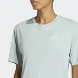 Remera deportiva Adidas Adi365 Essentials de color verde menta, con cuello redondo y mangas cortas. Cuenta con tecnología Climacool para la absorción del sudor, corte clásico y detalles reflectantes.