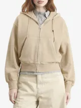 Campera con capucha Carhartt de corte oversize y silueta tipo globo, confeccionada en algodón teñido en prenda. Presenta cierre frontal, hombros caídos, puños y ruedo acanalados, y una etiqueta cuadrada distintiva aplicada en el pecho.