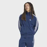 Campera deportiva Adidas Originals Firebird Drop Needle de color azul marino, con cierre frontal, cuello alto y bolsillos laterales. Presenta las clásicas tres tiras blancas en las mangas, el logotipo del Trifolio bordado en el pecho y un sutil patrón de rayas verticales en relieve.