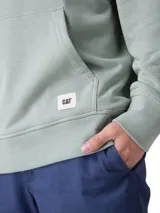 Buzo con capucha y bolsillo canguro de la marca Cat, color verde menta, con cordón de ajuste crudo, puños y dobladillo de punto acanalado, y pequeño logo estampado en el pecho.