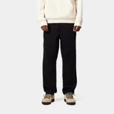 Pantalón de sarga de algodón orgánico con corte regular cónico, cinturilla elástica con cordón ajustable, bolsillos laterales para herramientas y bragueta con cremallera.